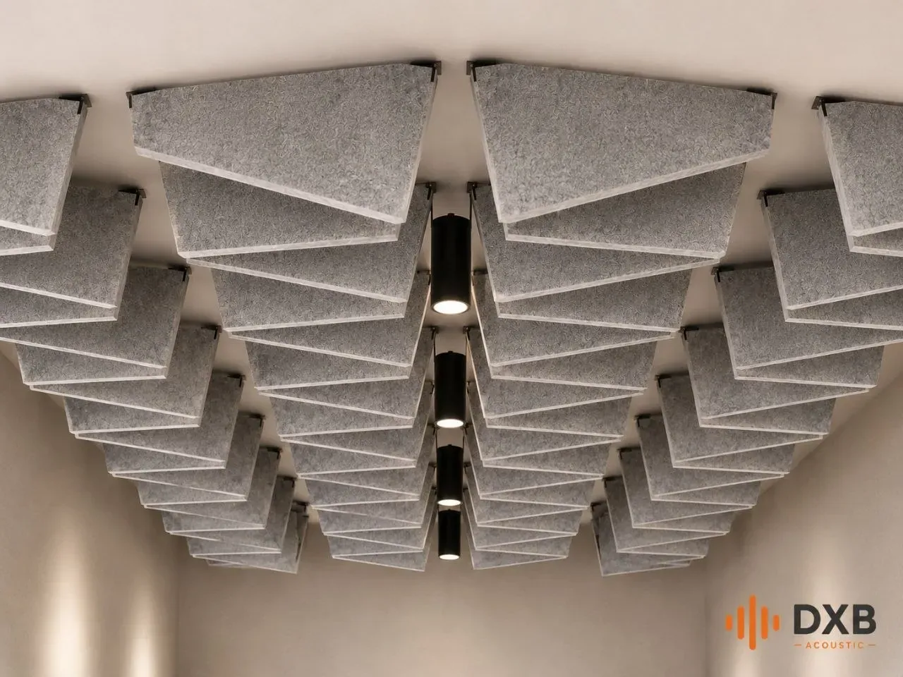 Wedge-profile sculptural baffle ceiling with linear lighting