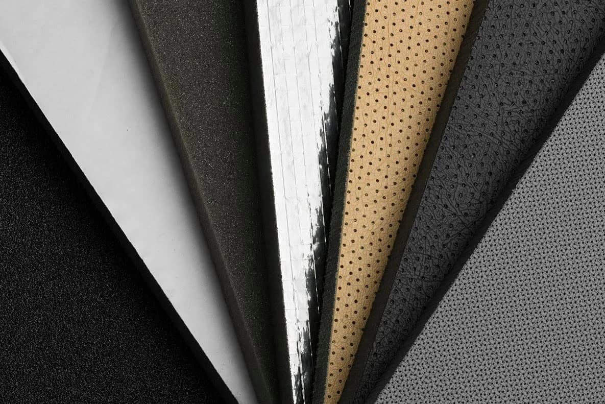 Acoustic foam, fabric-faced and perforated board samples fanned out
